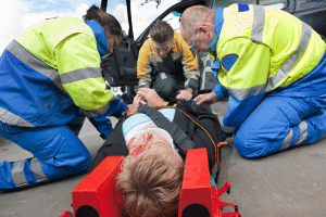 EMT Assisting a Head Injury Victim