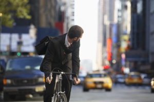 bicyclist on city streets shutterstock_146761643
