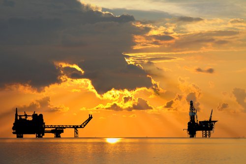 Silouette of offshore oil platforms