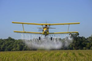 Plane aerial application of herbicide