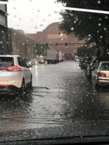 Cars driving through flood waters