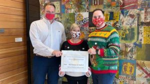 HHK Staff giving holiday donation to GNOF
