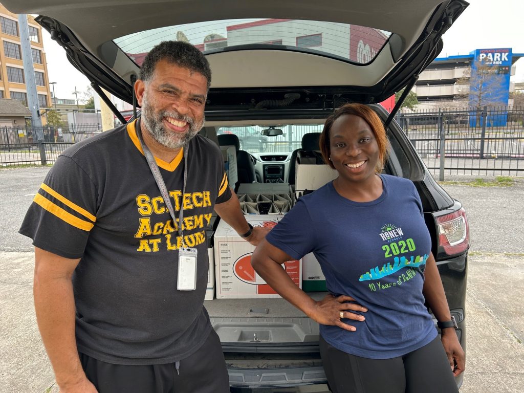 ReNEW Schools Representatives Jassman Claybrooks and Damitria Santiago with donations in the back of a vehicle