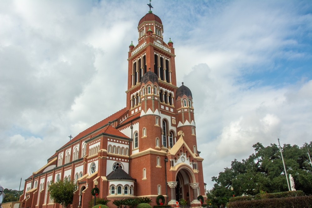 The historic Dutch Romanesque Revival style Cathedral of Saint John the Evangelist or La Cathedrale St-Jean built in 1916 on Cathedral Street in downtown Lafayette, Louisiana